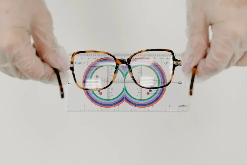 Patient trying on glasses at South Shore Eye Associates — North Easton optical dispensary