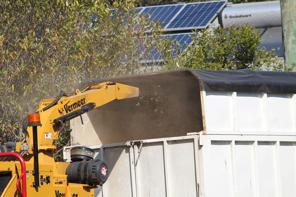 Wood Chipper Releasing The Shredded Woods — Hayden Tree Service In Cooranbong, NSW