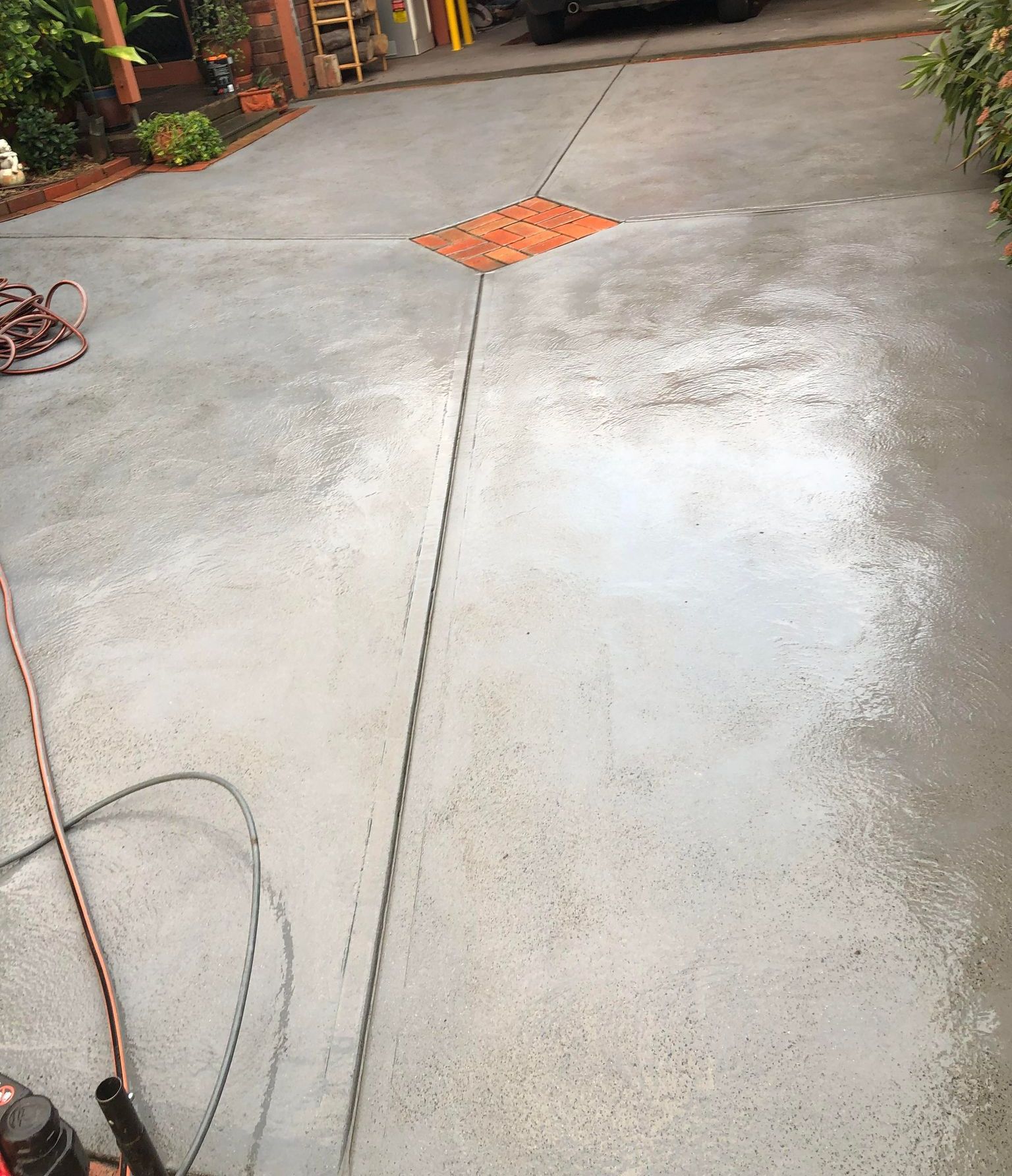 Pressure washing concrete to remove dirt and stains for a clean finish
