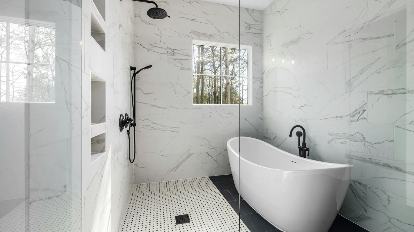 Modern white marble bathroom with walk-in shower, freestanding tub, and black fixtures
