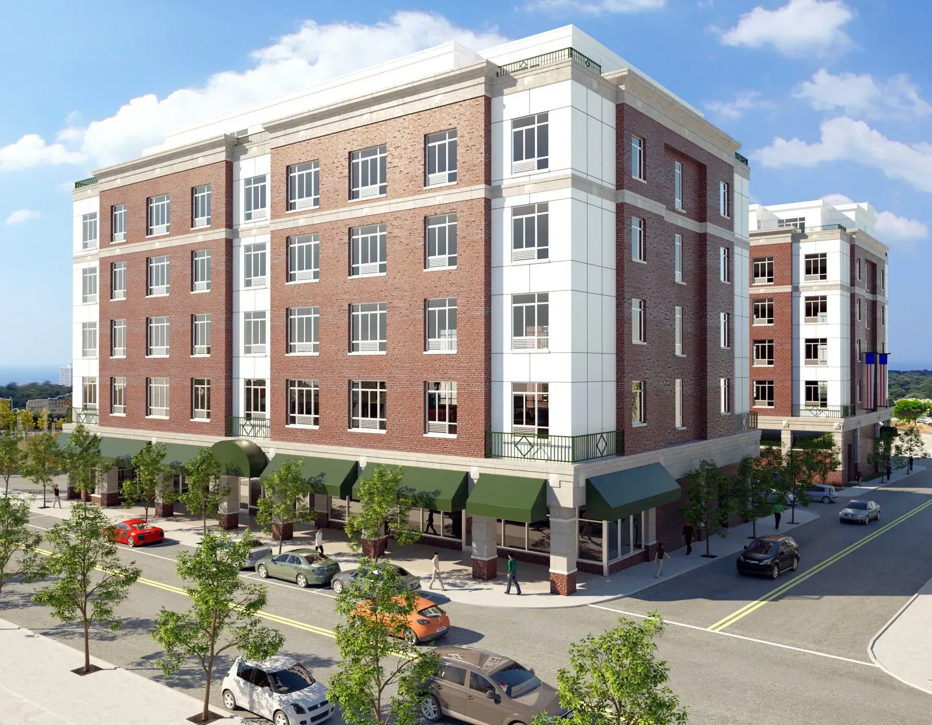 Brick apartment building with green storefront awnings on a sunny city street corner