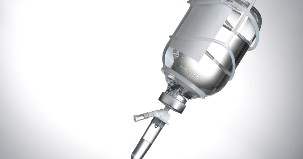 A stainless steel bottle with a syringe attached to it.
