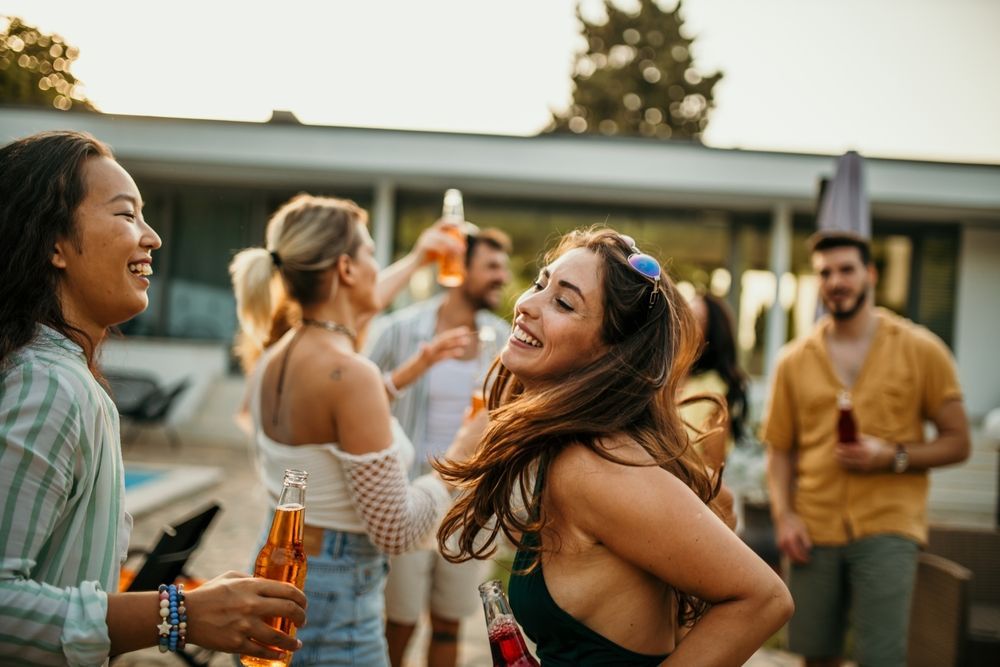 A group of people are having a party and drinking beer.