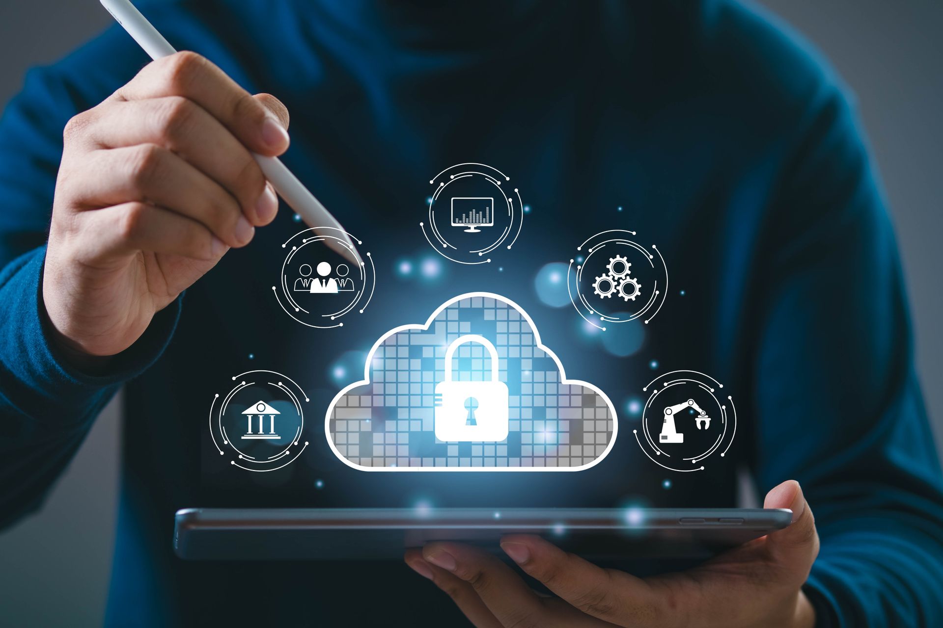 Person using a tablet and stylus, pointing at a cloud icon with a lock, surrounded by circular technology symbols.