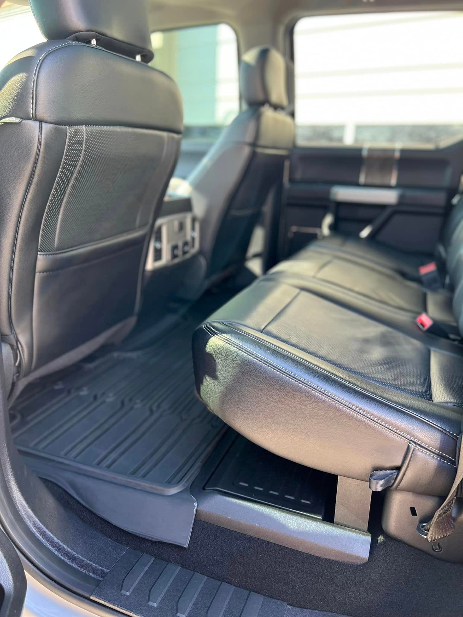 A close up of the back seat of a ford f-series truck.