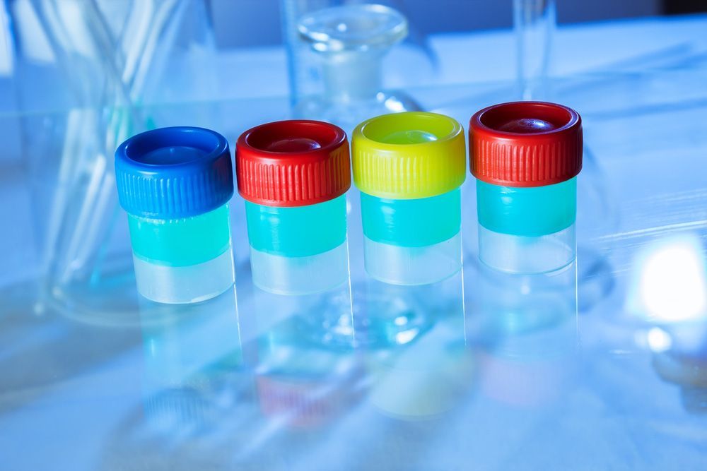 A Row Of Test Tubes Filled With Different Colored Liquids On A Table — Eureka Water & Filtration In Mount St John, QLD