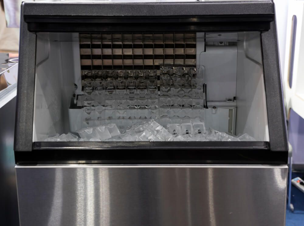 A Stainless Steel Ice Maker Filled With Ice Cubes — Eureka Water & Filtration In Mackay, QLD