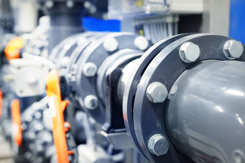 A Close Up Of A Row Of Pipes And Valves In A Factory — Eureka Water & Filtration In Mount St John, QLD