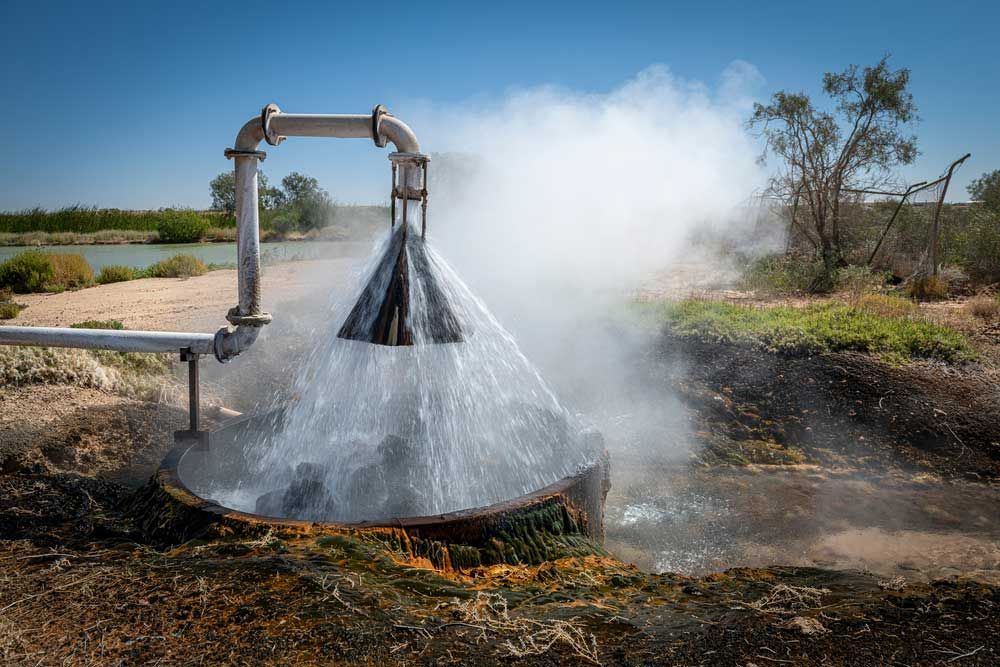 A Large Pipe With Water Coming Out Of It — Eureka Water & Filtration In Mount St John, QLD