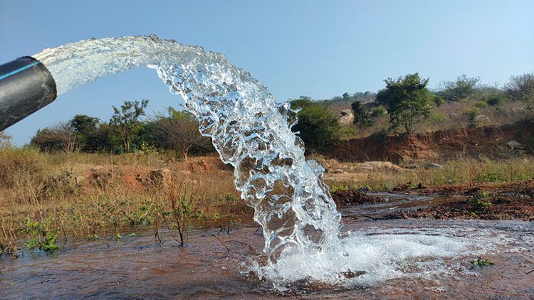 Water Is Being Pumped From A Pipe Into A Body Of Water — Eureka Water & Filtration In Mackay, QLD