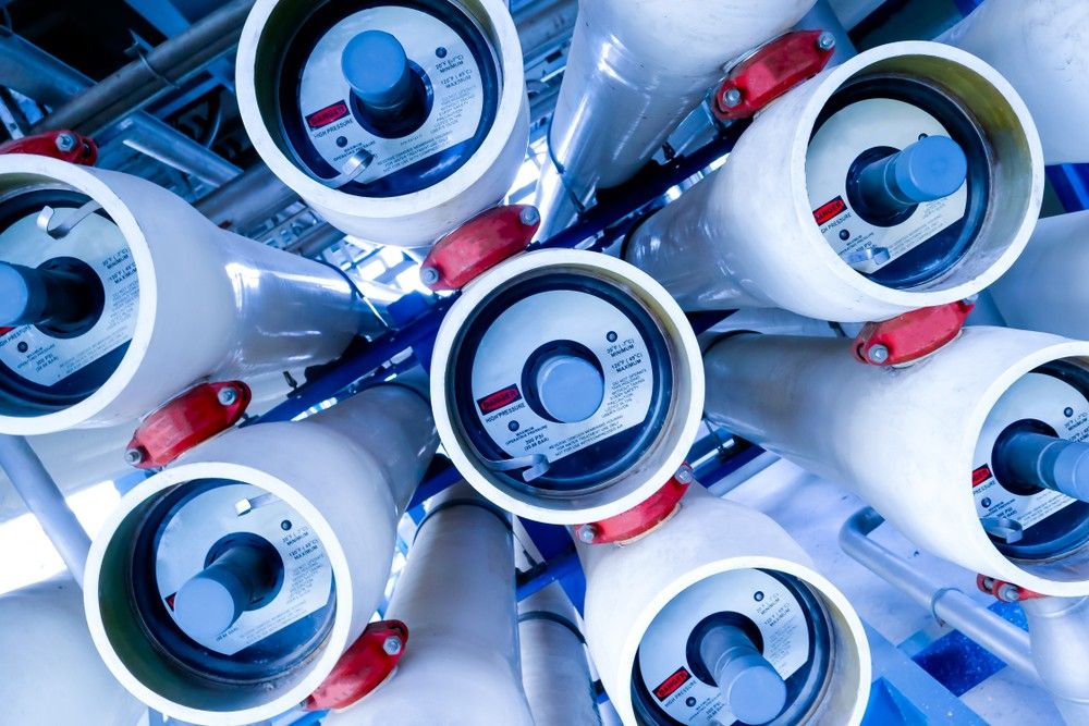 A Bunch Of Water Meters Are Stacked On Top Of Each Other — Eureka Water & Filtration In Mount Isa, QLD