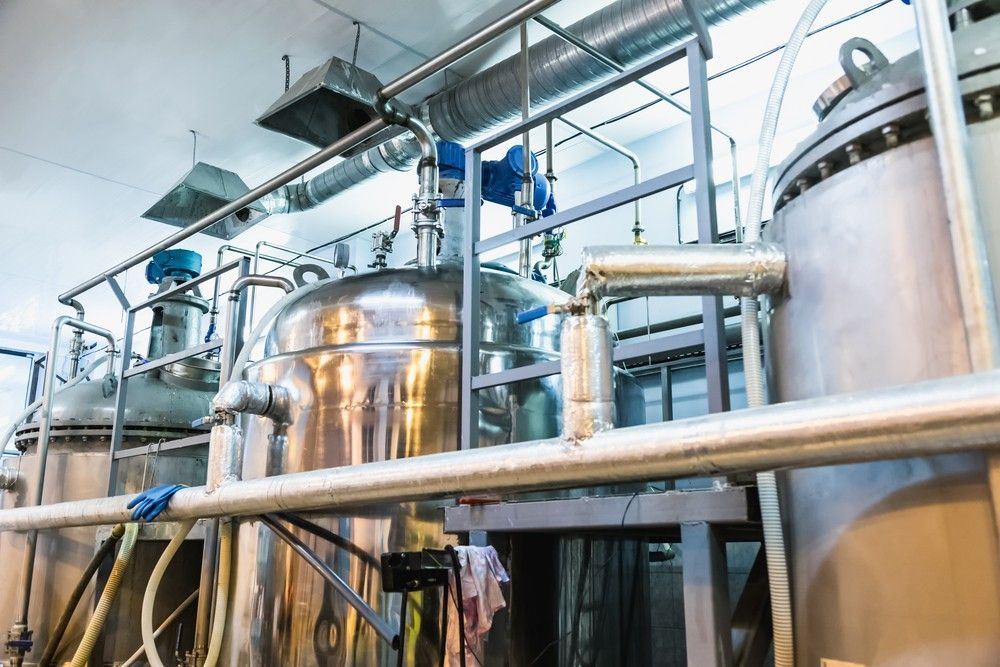 A Factory With A Lot Of Stainless Steel Tanks And Pipes — Eureka Water & Filtration In Mount Isa, QLD