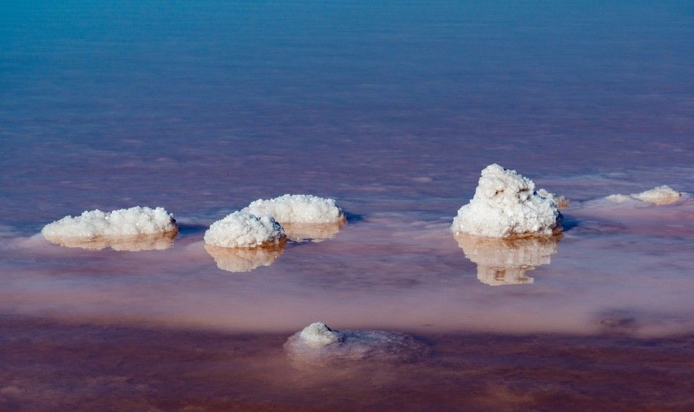 A Group Of Salt Crystals Floating On Top Of A Body Of Water — Eureka Water & Filtration In Mackay, QLD