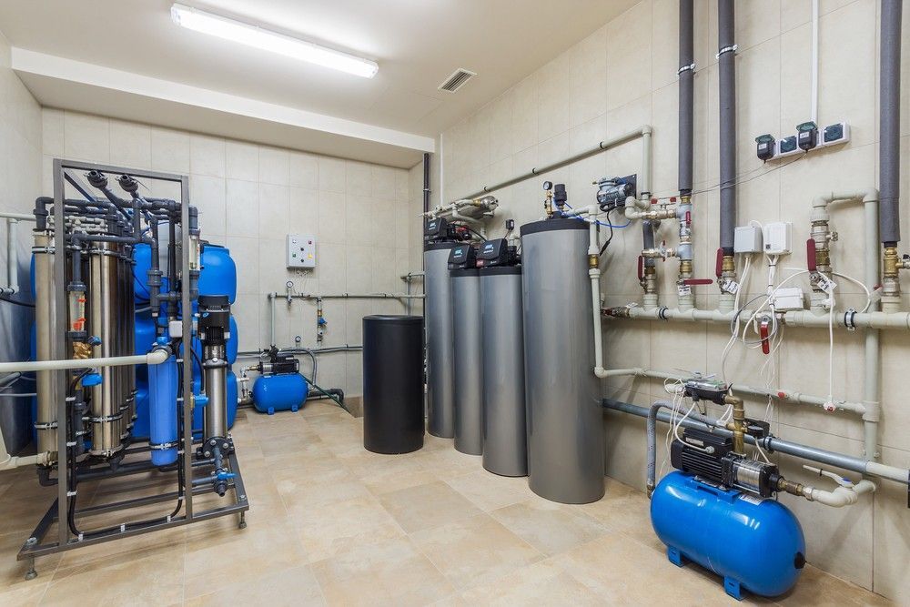A Room With A Lot Of Pipes And Pumps In It — Eureka Water & Filtration In Cairns, QLD