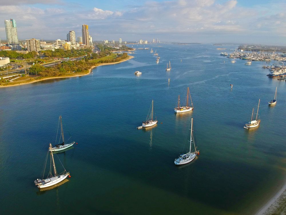 A Group of Sailboats Are Floating on Top of a Body of Water — Wilson's House Restumping in Broadwater, NSW