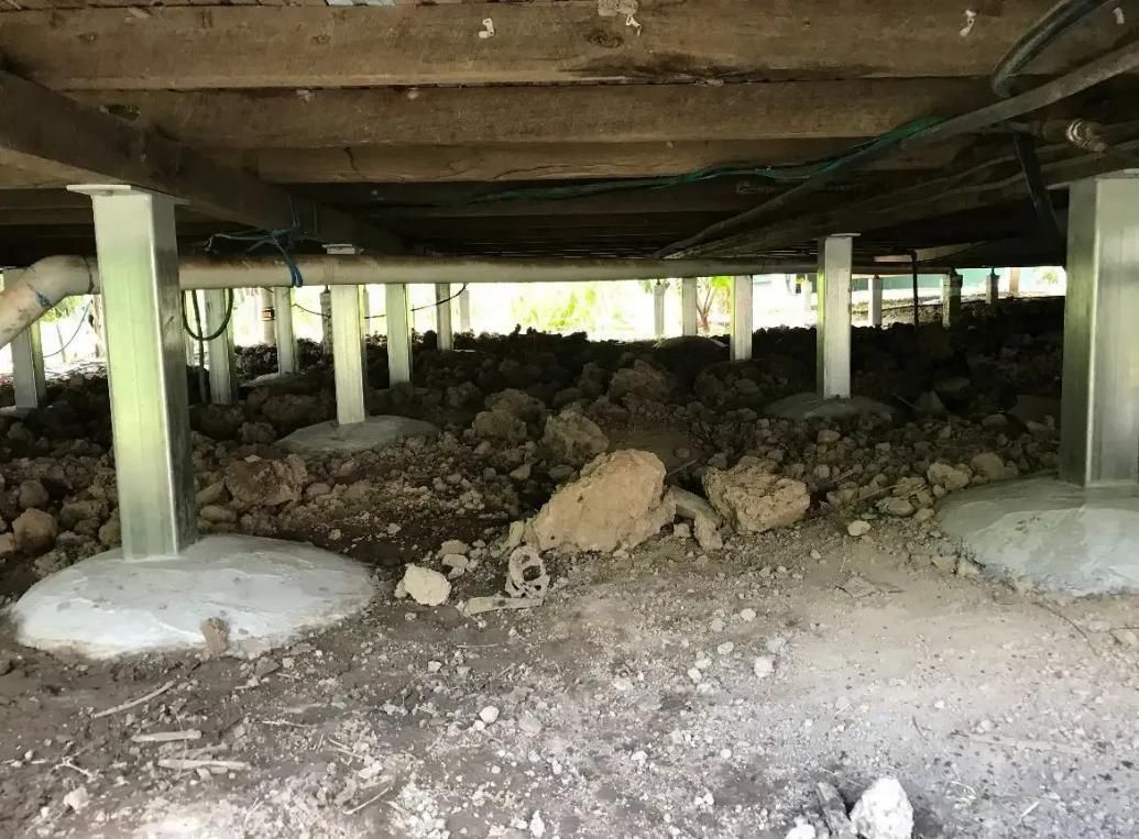 Underside of a House With a Lot of Dirt and Rocks — Wilson's House Restumping in Goonellabah, NSW