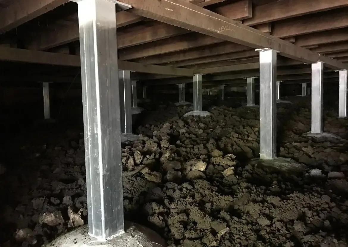 There is a Lot of Dirt Underneath the Foundation of a House — Wilson's House Restumping in Goonellabah, NSW