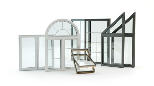A group of different types of windows are sitting next to each other on a white surface.