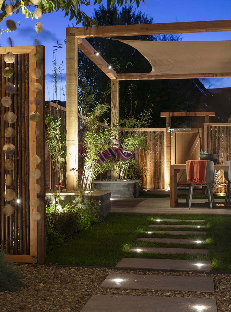 A picture of a walkway with in lite written on it. landscape lighting