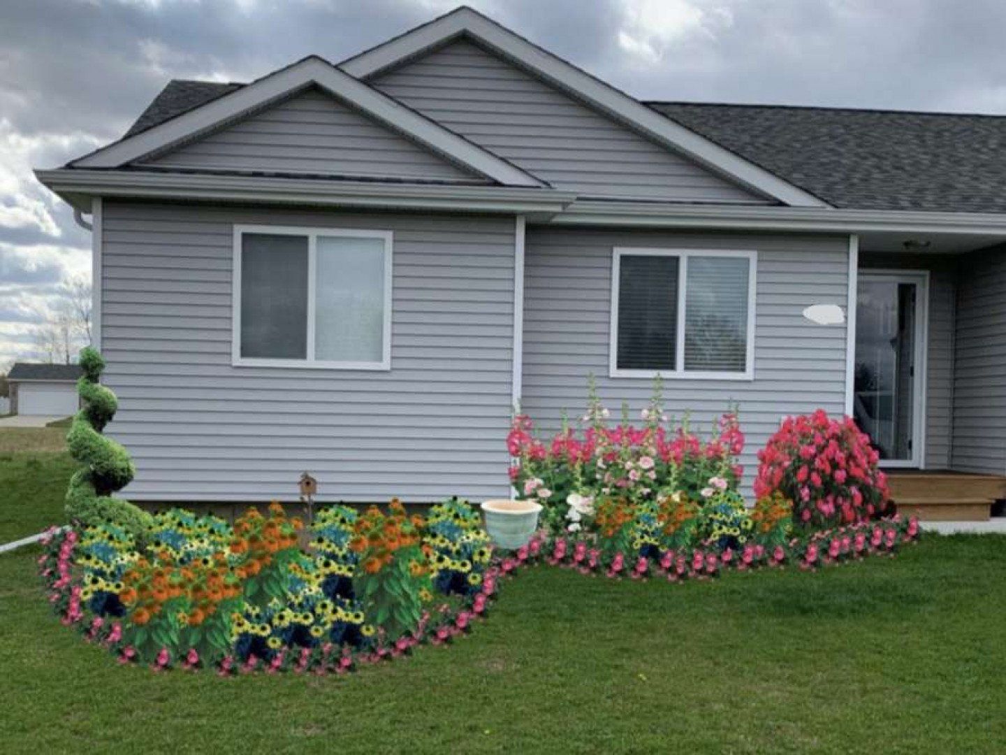 A house with a garden in front of it