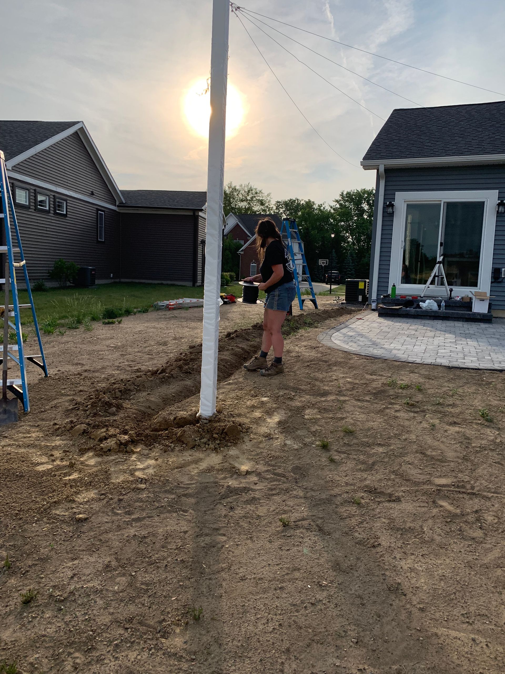 Digging a trench for Edison lights in michigan. 