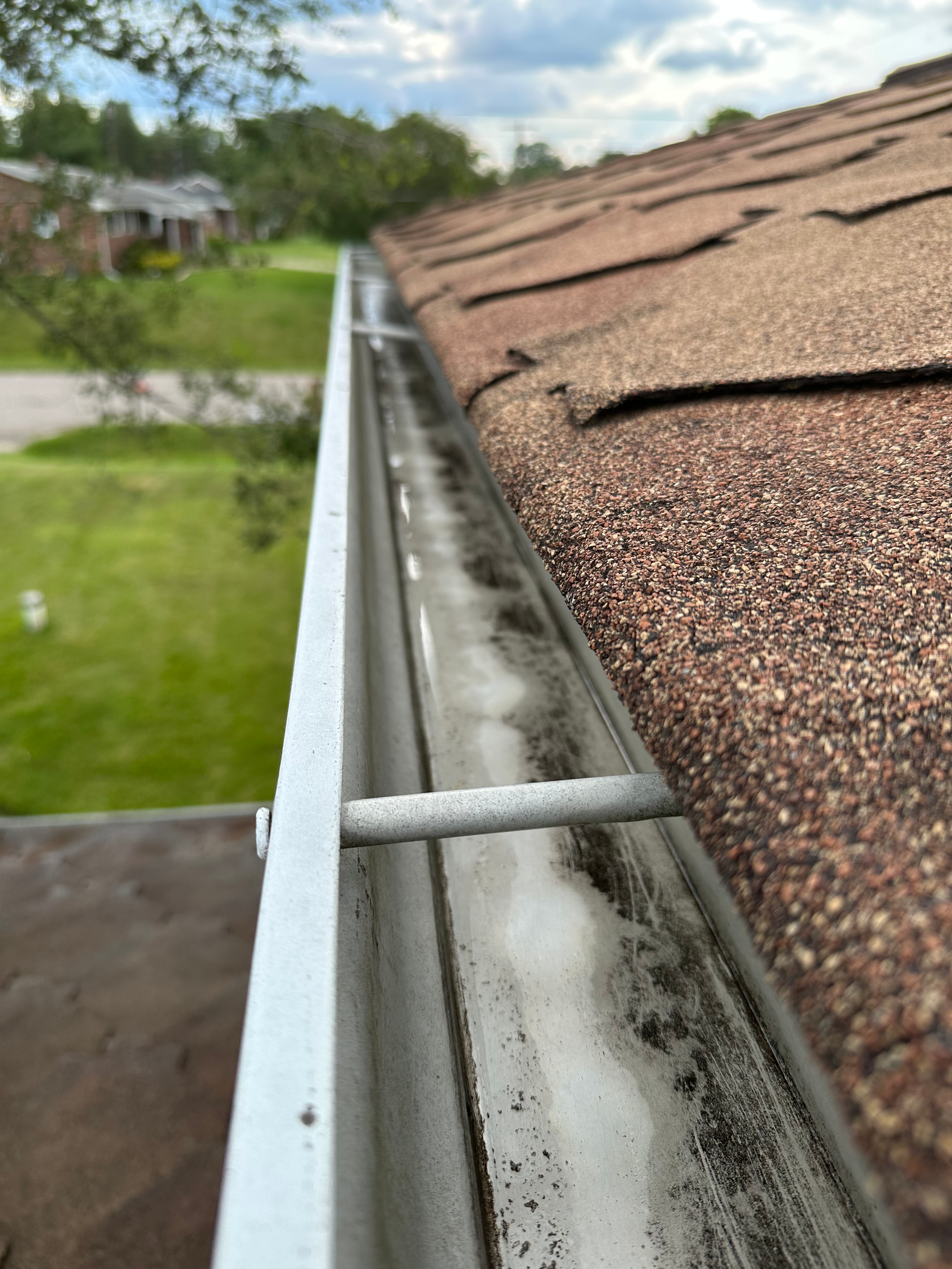 A close up of a gutter on top of a roof.