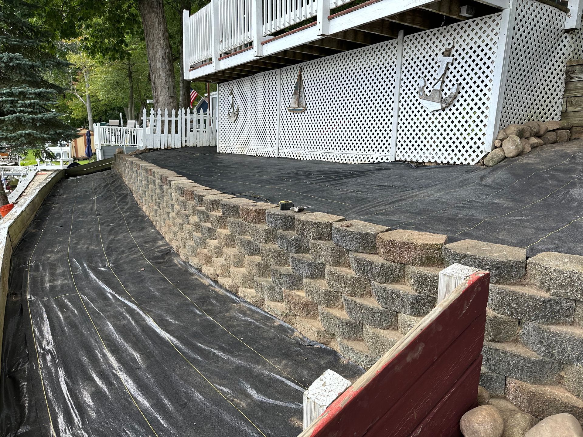 A pile of mulch is sitting in front of a house. mulch installation