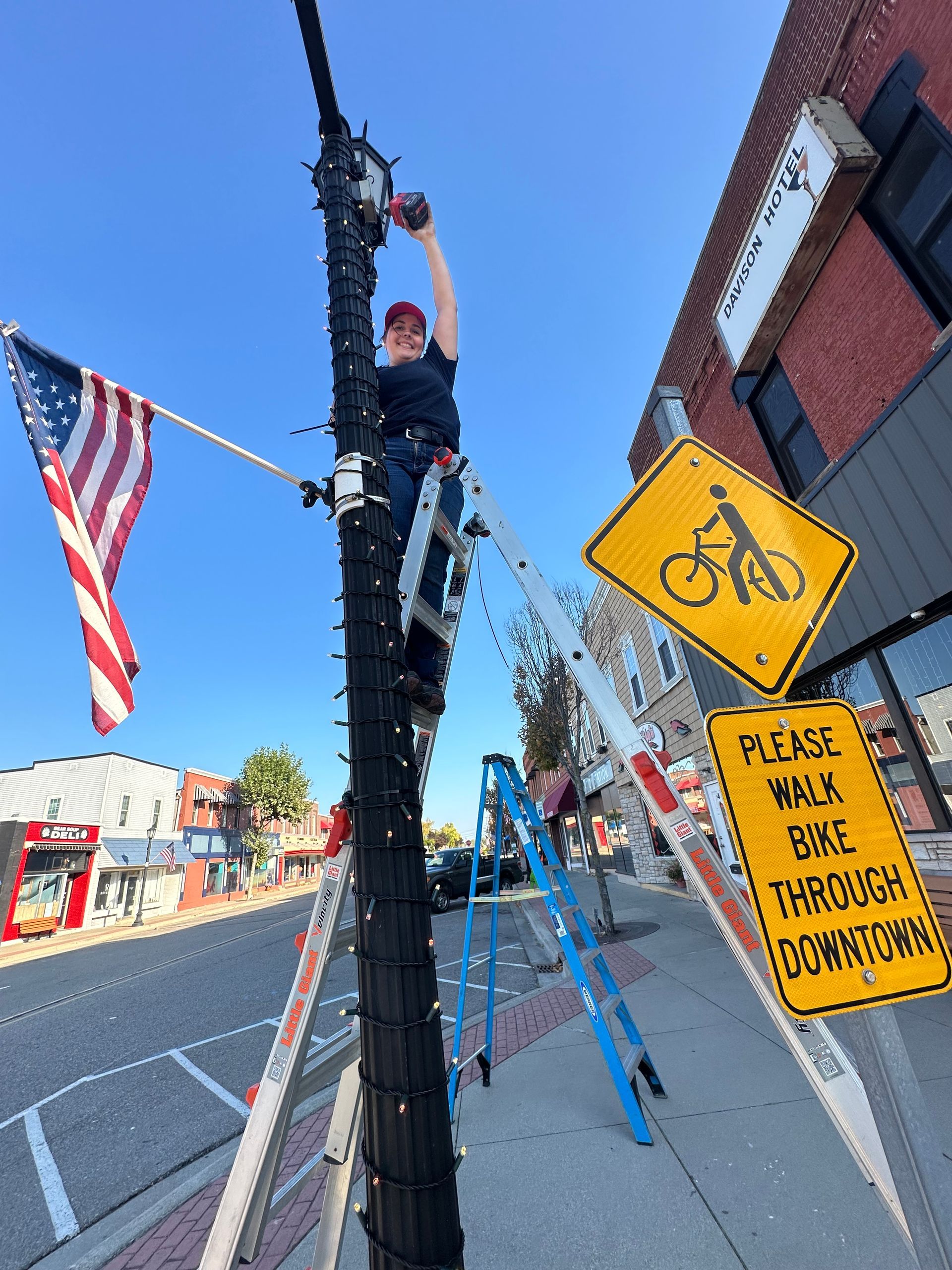 Commercial project downtown davison michigan. 16 light poles decorated in s4 King of strings permanent mini lights. municipality of 