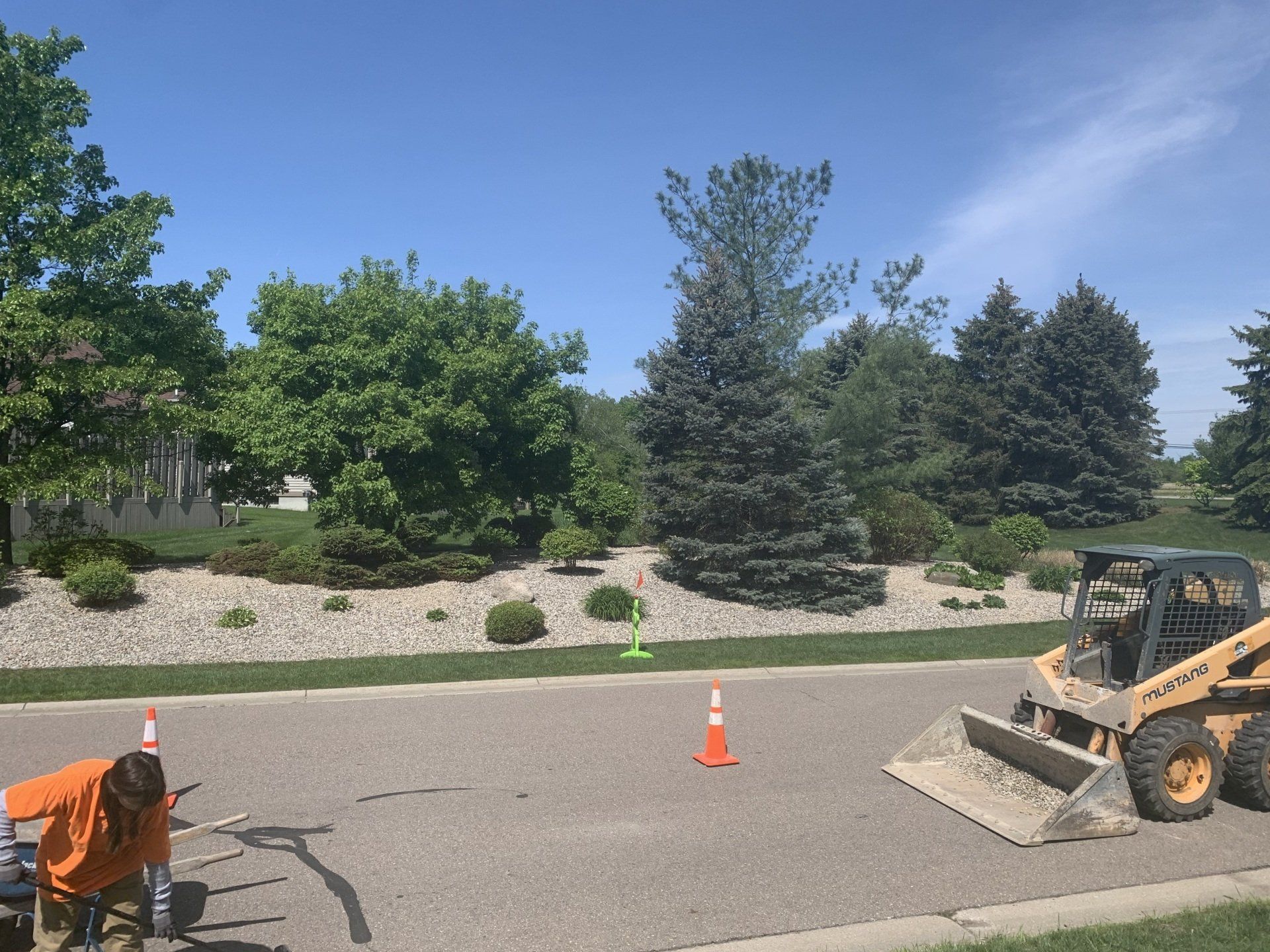 A roundabout with a sign that says forest view. commercial landscape