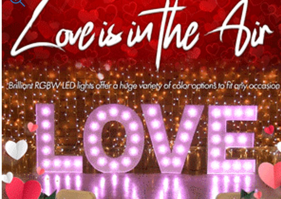 The letters in the word LOVE lit. Wedding lighting. 