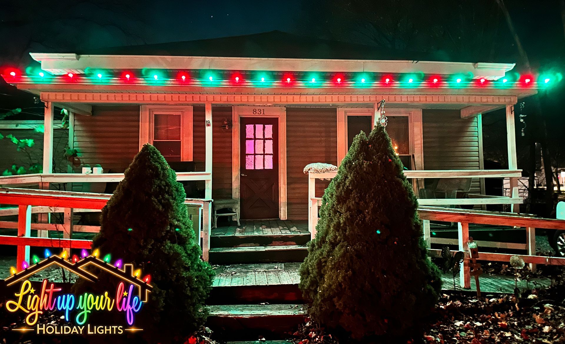 Green and red C9 Christmas lights on a residential home in Lapeer michigan 