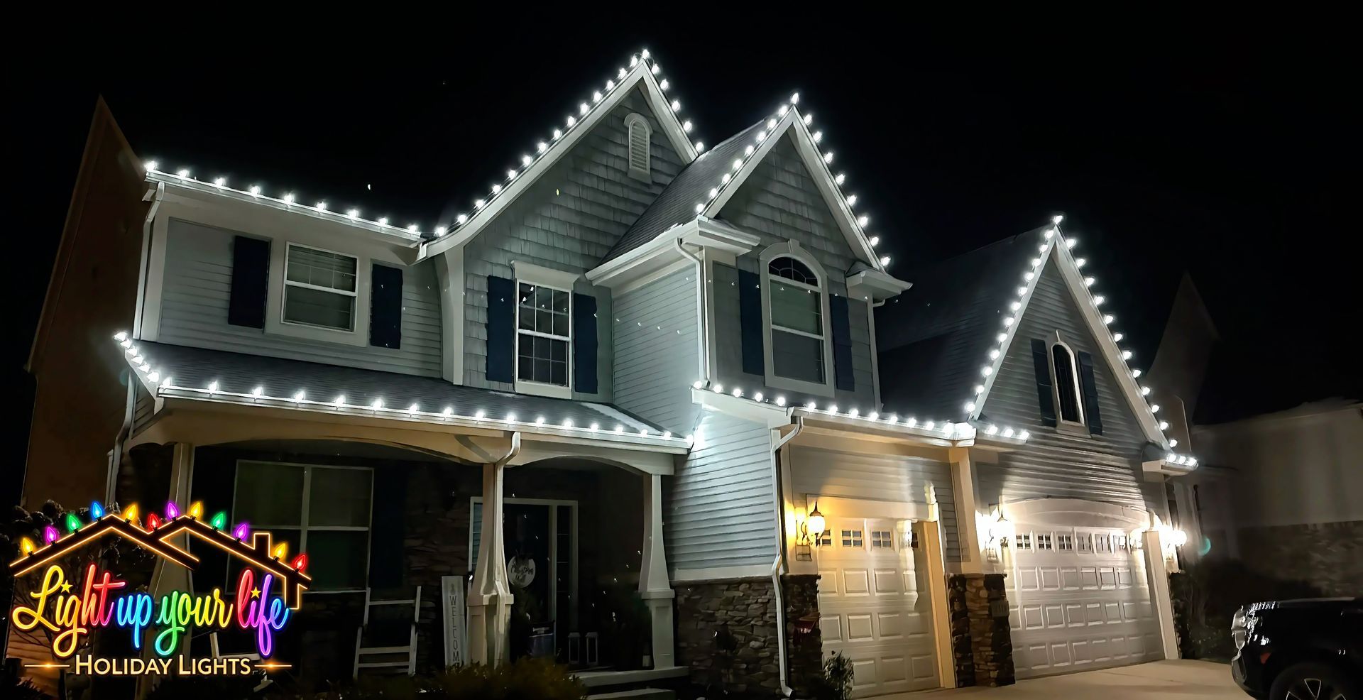 Professional lighting in the cool white color on roofline in Milford Michigan. Residential property.  Christmas light installations in michigan.