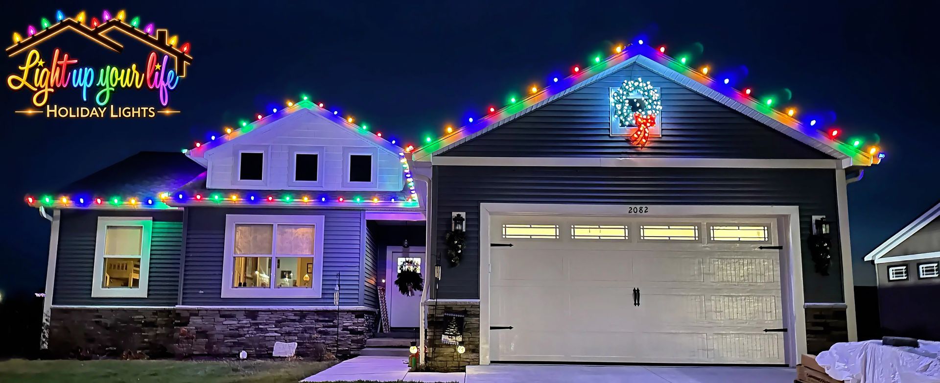 Multi colored Commercial roofline. wreath lit in all colors. Davison Michigan lighting. 