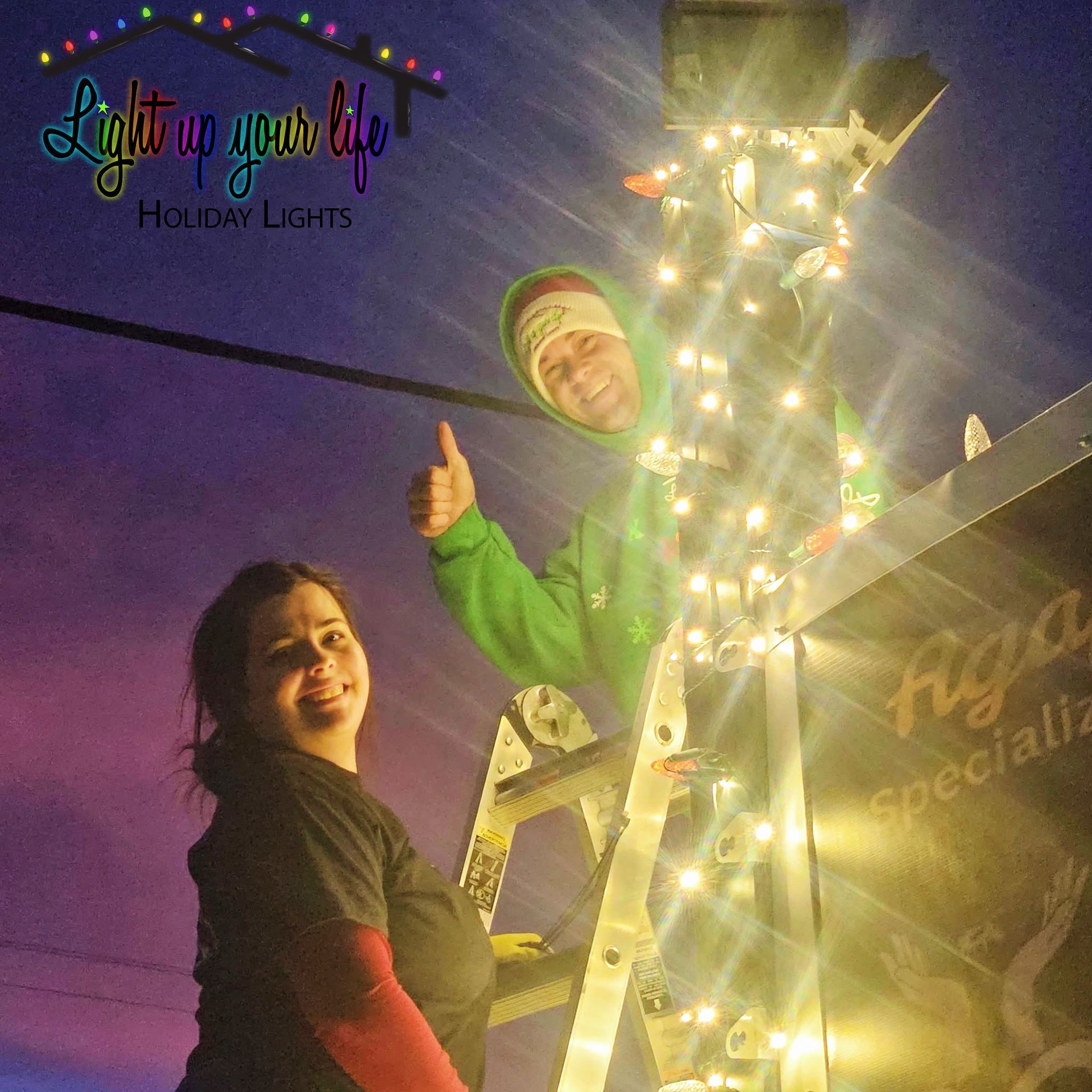 2 certified light installers standing next to their commercial project in davison michigan