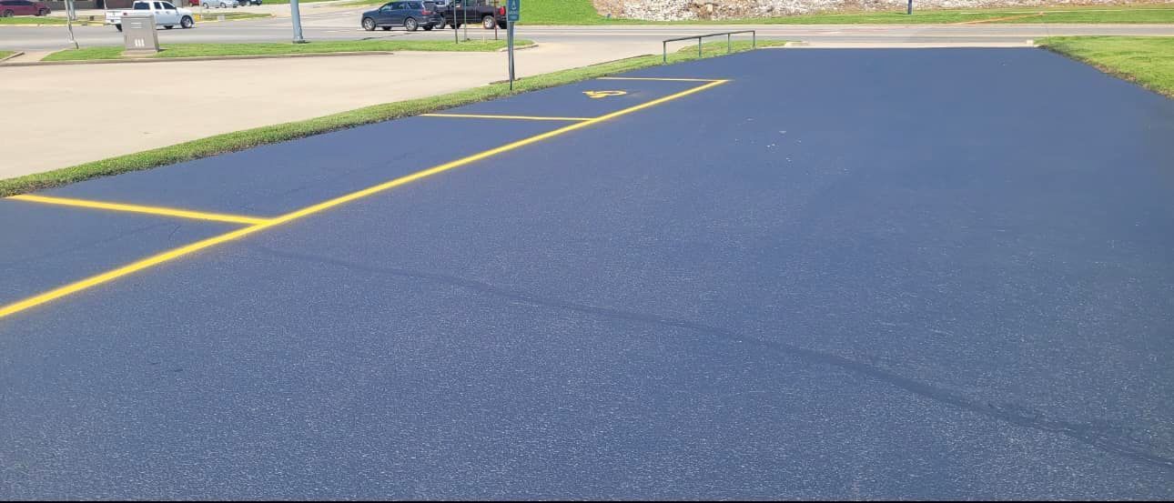 A parking lot with a yellow line on the side of it.
