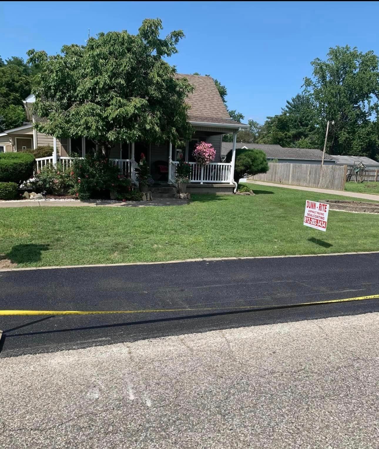 A house with a for sale sign in front of it