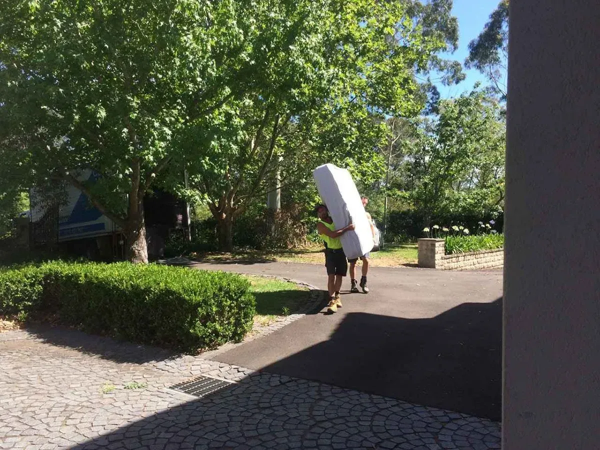 Men carrying bed outside | Camden, NSW | Camden Valley Removals