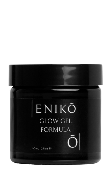 ENIKŌ Glow Gel Formula, a natural, botanically based, moisturizing gel in a black glass jar.