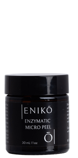 ENIKŌ Enzymatic Micro Peel, a botanical enzyme peel in a black glass jar.