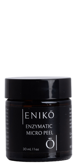 ENIKŌ Enzymatic Micro Peel, a botanical enzyme peel in a black glass jar.
