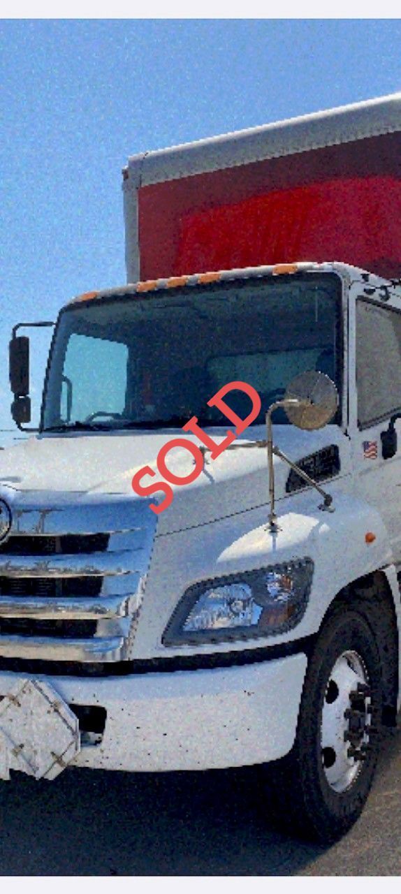 White box truck with a red top, 