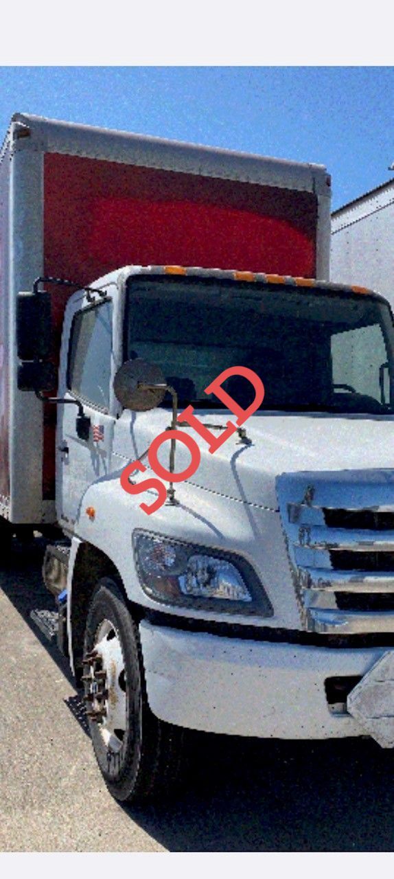 White box truck, marked 