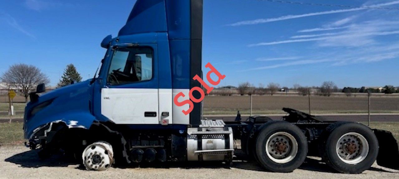 Blue and white semi-truck with a 