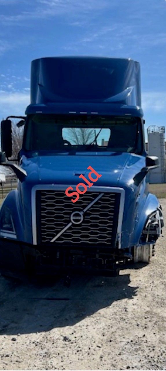 Blue Volvo semi-truck with 