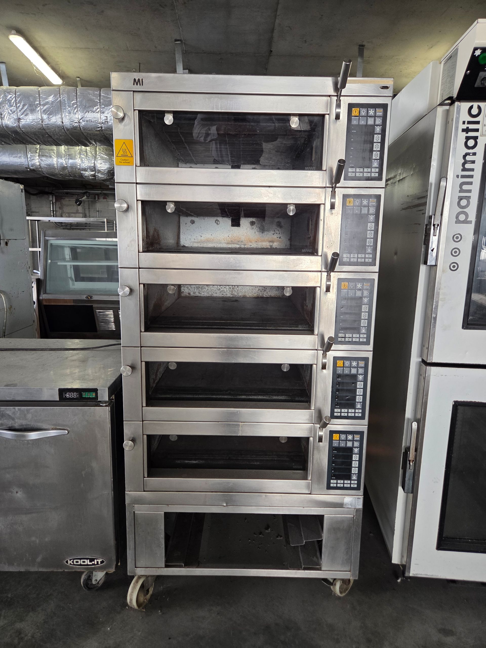 A multi-deck commercial oven with stainless steel finish.