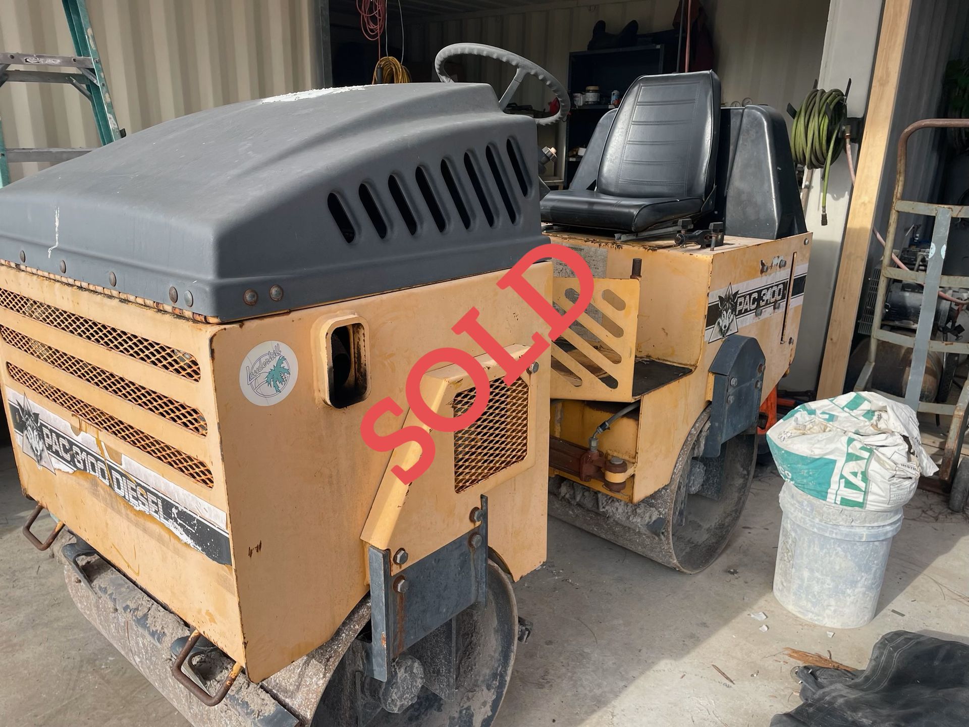 A yellow road roller with 