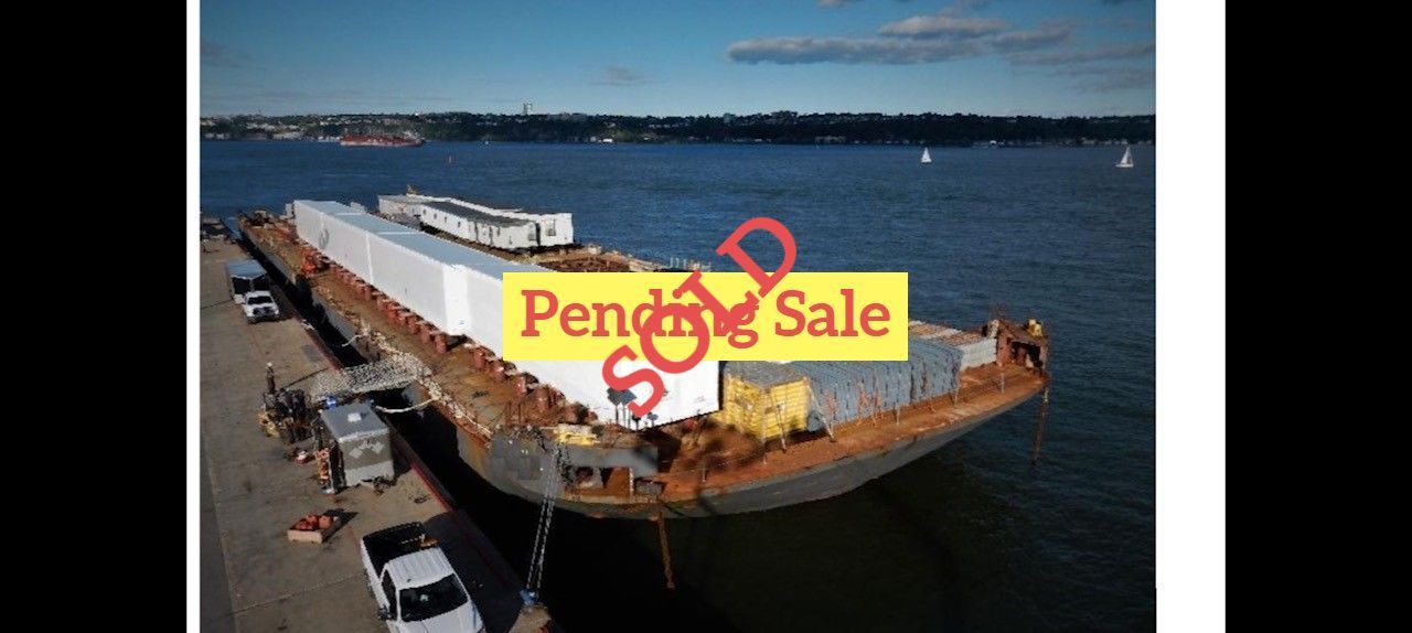 A large barge at a dock with 