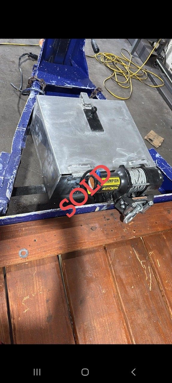A blue and metal industrial machine with a 