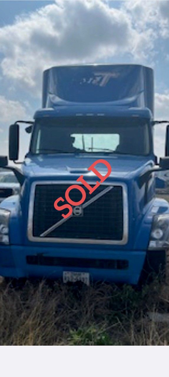 Blue Volvo semi-truck with 