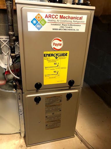 A furnace with a sticker on it that says `` arcc mechanical ''.